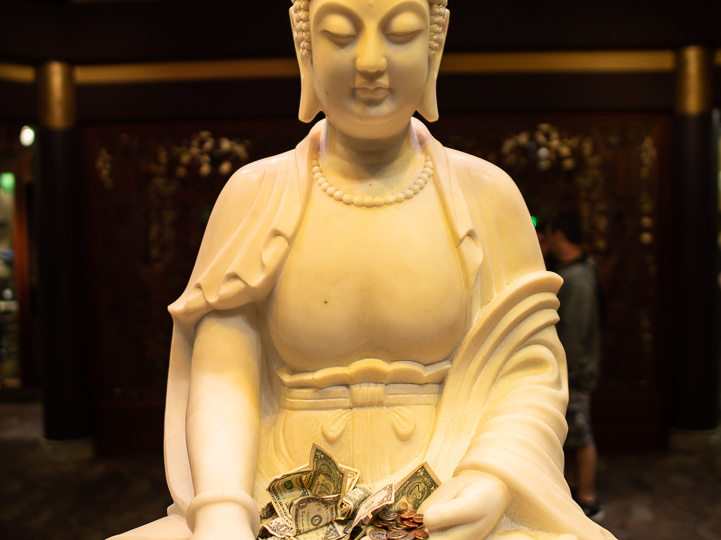 Buddha with money