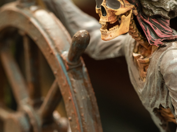 Skeleton helmsman figure